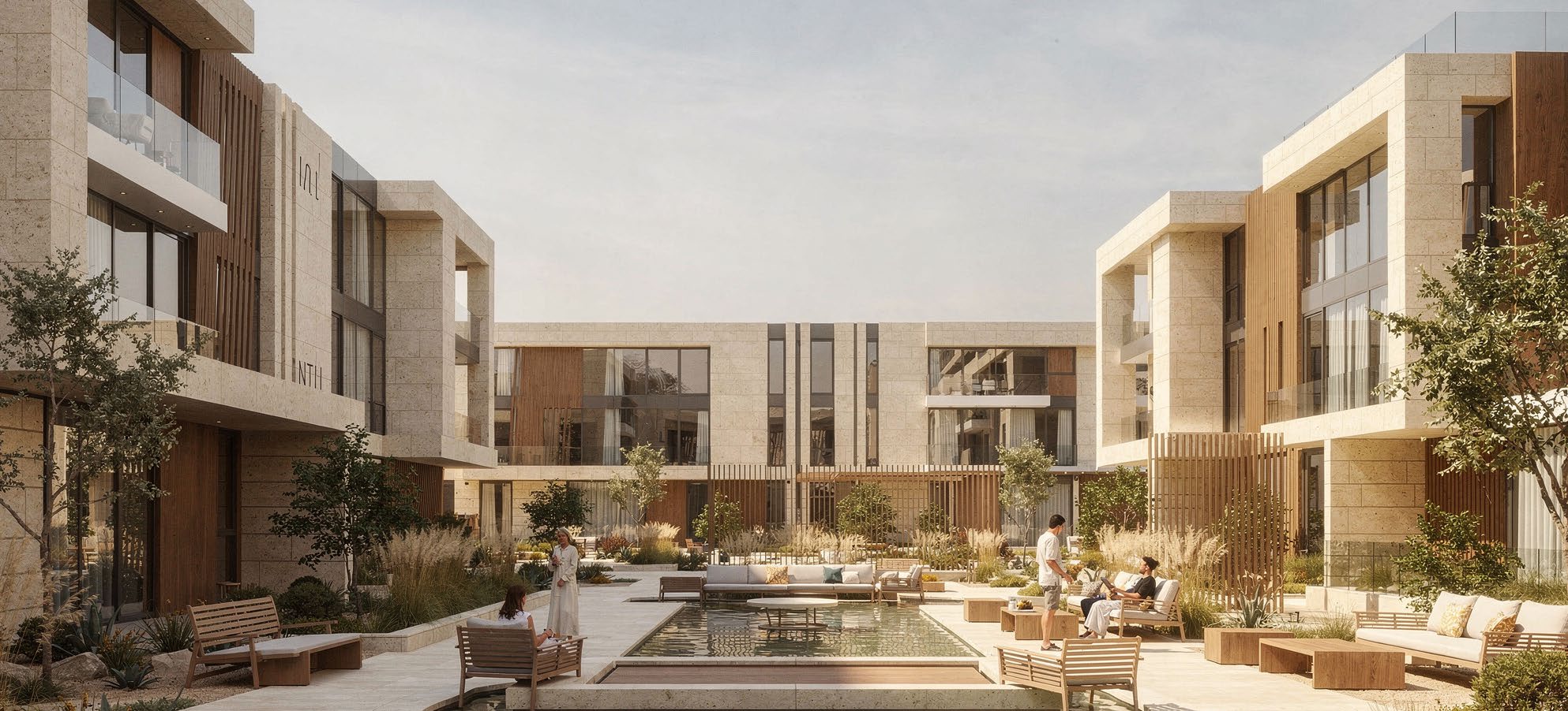 Namaya community courtyard with a landscaped pool and warm stone residences in natural daylight