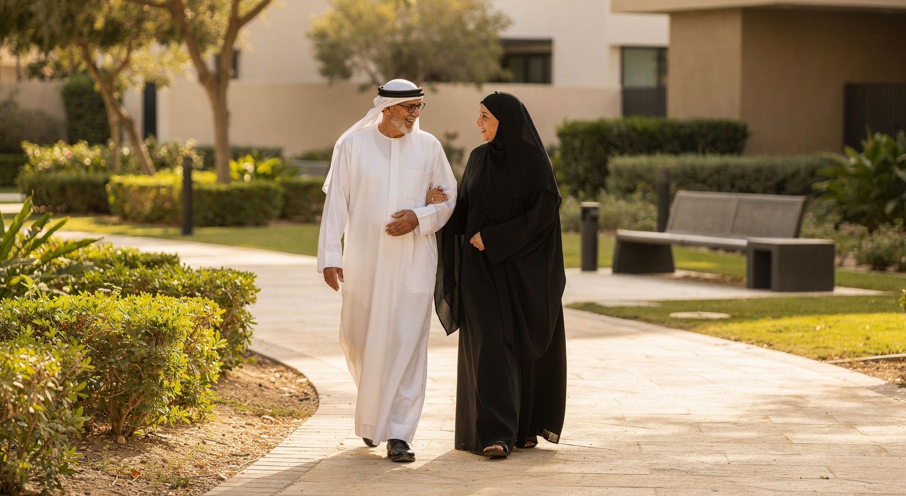 An Emirati couple in a calm, warm Namaya interior